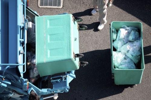 Man and van preparing a load outside a terraced office in Sanderstead