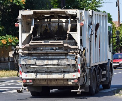 Maintenance check on waste collection vehicle